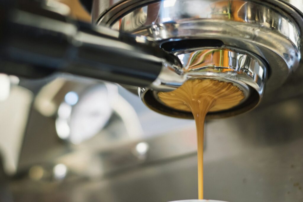Close-up of espresso pouring from a portafilter